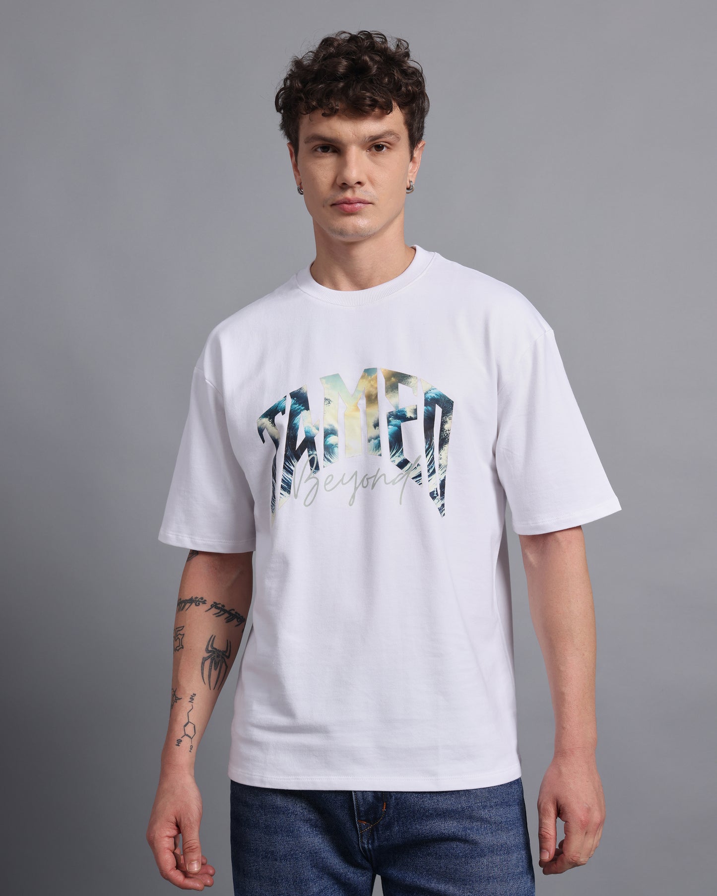 "TAMED BEYOND?"- white oversized tee