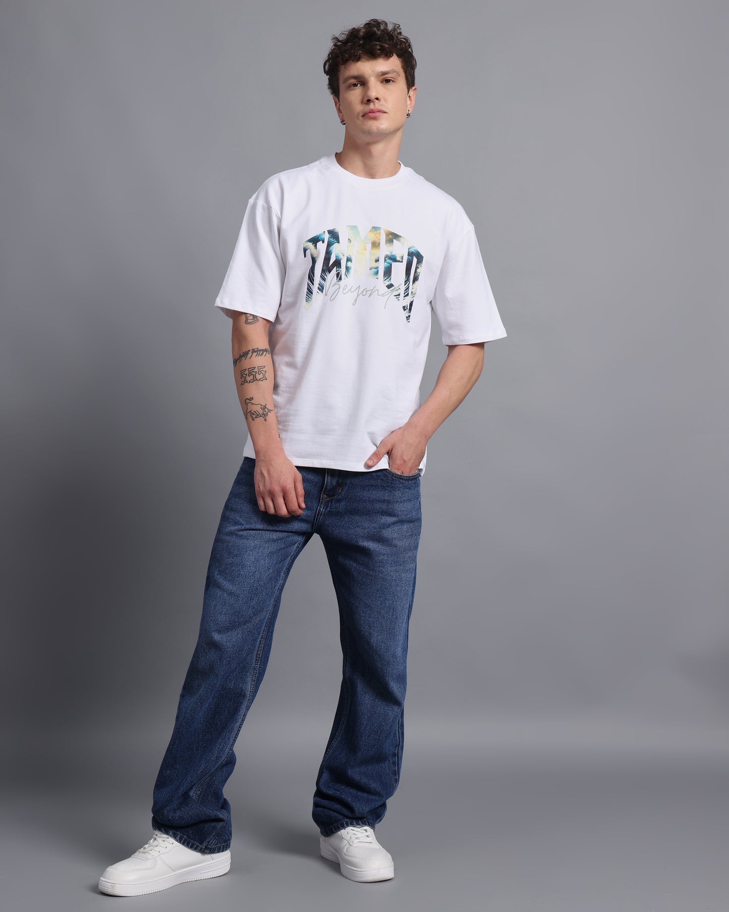 "TAMED BEYOND?"- white oversized tee